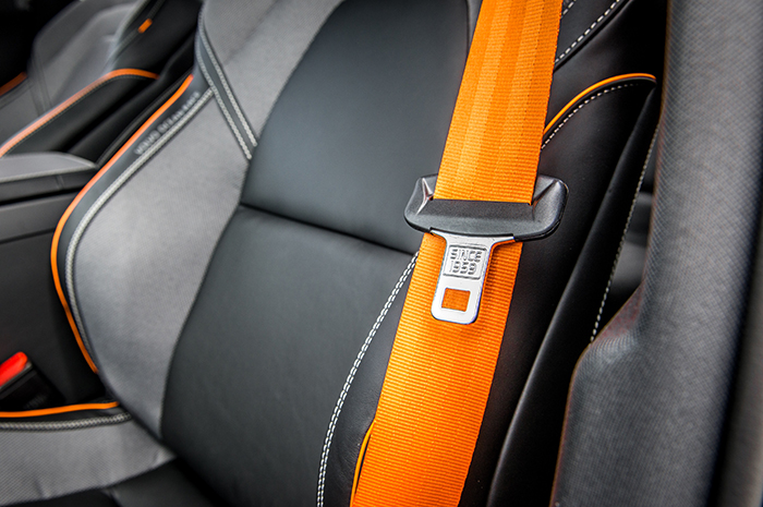 The requirement of using a seat belt in the front seat of a motor vehicle